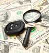 Keys from the car and a magnifier on money.