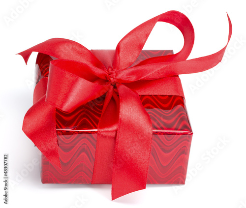Photo: Red gift tied up by a bow Red gift tied up by a bow
