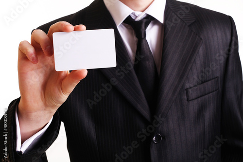 Photo: Businessman showing his business card. You can just add your tex Businessman showing his business card. You can just add your tex