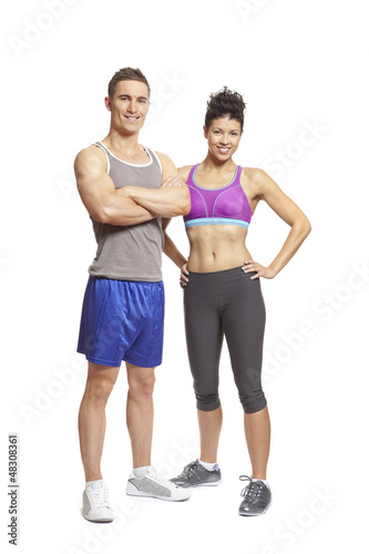 Photo: Young man and woman relaxing in sports outfits Young man and woman relaxing in sports outfits