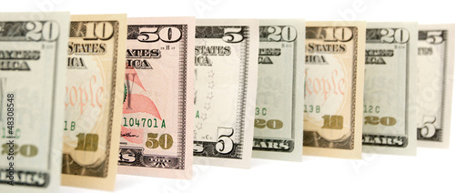 Photo: Dollars. On a white background. Dollars. On a white background.
