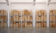 3d rendered warehouse with many stacked boxes on pallets