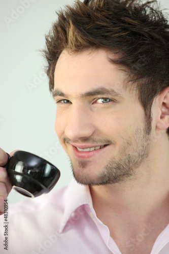 Photo: Smiling man drinking tea Smiling man drinking tea