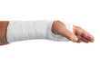 Photo: Broken arm with a plaster cast isolated on white Broken arm with a plaster cast isolated on white