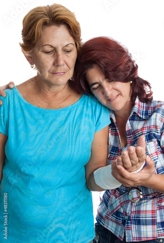 Photo: Elderly woman with a broken arm and her caregiver Elderly woman with a broken arm and her caregiver