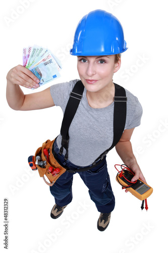 Photo: Electrician with a handful of cash Electrician with a handful of cash