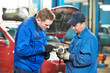 Foto: two car mechanic diagnosing auto engine problem two car mechanic diagnosing auto engine problem