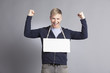 Joyous successful man presenting empty signboard.