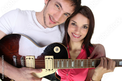 Photo: Couple with electric guitar Couple with electric guitar