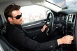 Man in black in luxury car