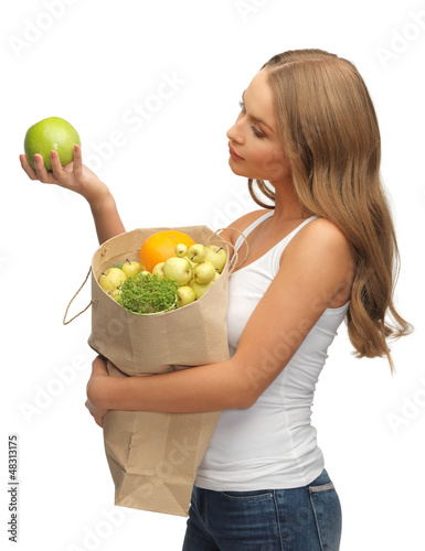 Photo: woman with shopping bag full of fruits woman with shopping bag full of fruits