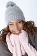 Beautiful ethnic girl smiling in winter outfit