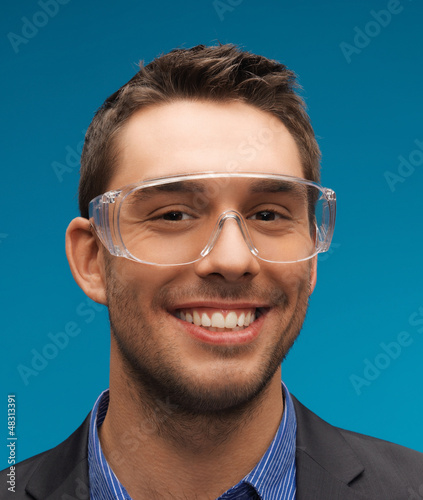Photo: businessman in protective glasses businessman in protective glasses