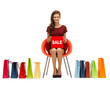 girl in red dress with shoes, bag and sale sign