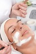 Applying facial cream by brush