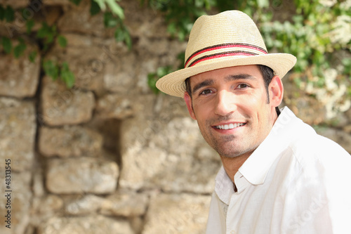 Photo: man with sunhat posing outdoors man with sunhat posing outdoors