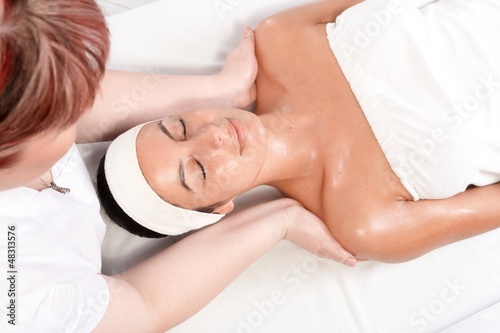 Photo: Pampering massage in beauty saloon Pampering massage in beauty saloon