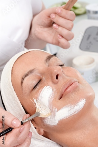 Photo: Applying facial cream by brush Applying facial cream by brush