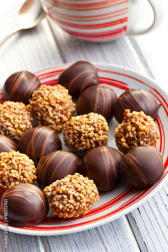 Photo: chocolate pralines in plate chocolate pralines in plate