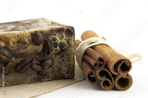 Photo: spa composition with natural soap and cinnamon sticks spa composition with natural soap and cinnamon sticks