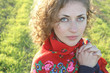 Beautiful curly woman at the fields