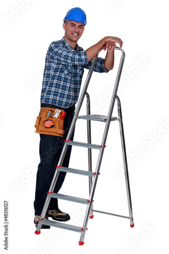 Photo: Worker with a stepladder Worker with a stepladder