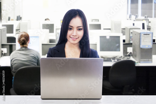 Photo: Asian businesswoman in office work place Asian businesswoman in office work place