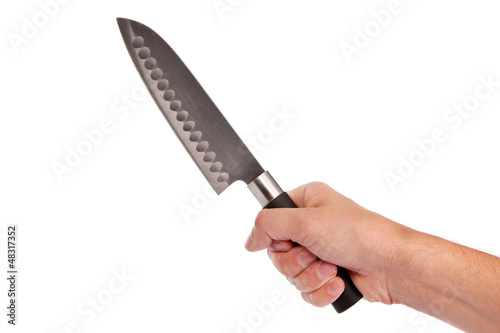 Photo: Hand is holding a kitchen kinfe isolated Hand is holding a kitchen kinfe isolated