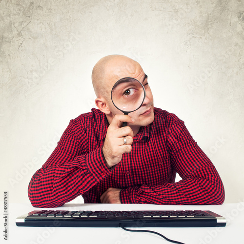 Photo: man with magnifying glass man with magnifying glass