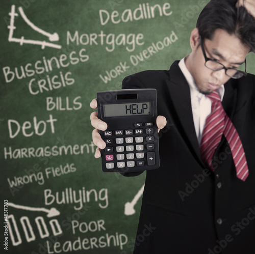 Photo: Businessman needs help Businessman needs help