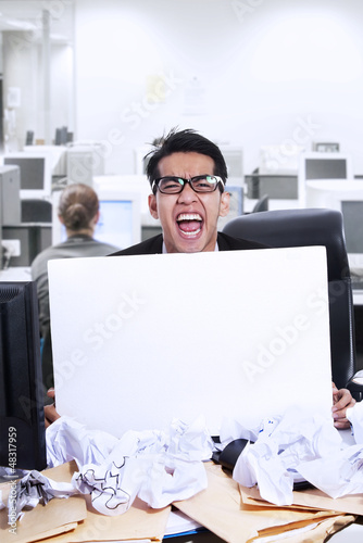Photo: Businessman scream and blank paper Businessman scream and blank paper