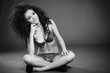 Black and white portrait of stunning curly woman