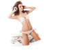 Curly woman with white lingerie and headphones in the bed