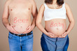 belly of pregnant wife and husband