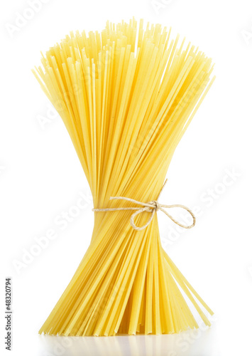 Photo: Linguine pasta tied with old rope isolated on white background Linguine pasta tied with old rope isolated on white background