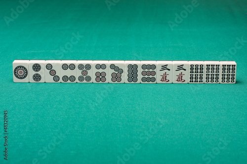 Photo: Smooth table surface with a mahjong on it Smooth table surface with a mahjong on it