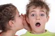 Foto: little girl whilspering secret little girl whilspering secret