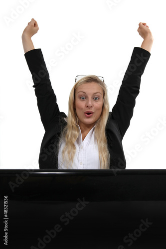 Photo: Ecstatic blond businesswoman Ecstatic blond businesswoman