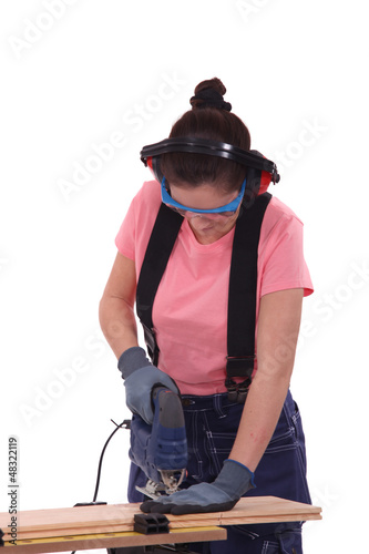 Photo: Safety conscious female carpenter Safety conscious female carpenter