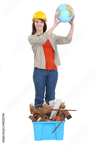 Photo: craftswoman raising a globe craftswoman raising a globe