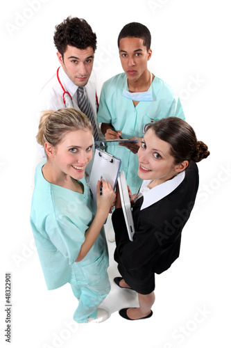 Photo: Hospital staff huddling Hospital staff huddling