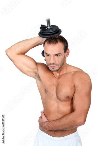 Photo: young man with dumbell young man with dumbell