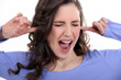 Photo: Woman with her fingers in her ears Woman with her fingers in her ears
