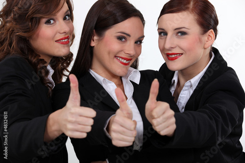 Photo: Three businesswomen giving the thumbs-up Three businesswomen giving the thumbs-up
