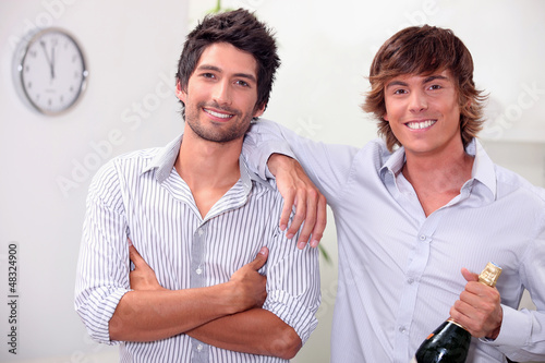 Photo: Men with champagne at midnight Men with champagne at midnight