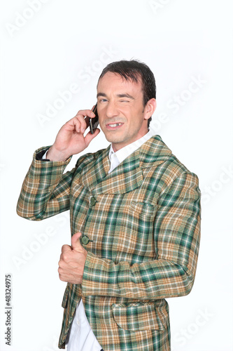 Photo: Farmer on the phone Farmer on the phone