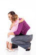 little girl hugging mother isolated on white