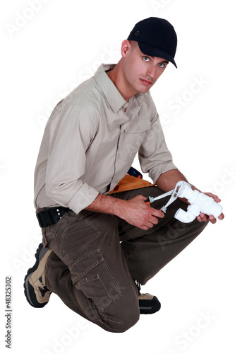 Photo: craftsman fixing a pipe craftsman fixing a pipe