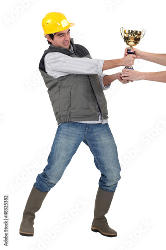 Photo: Builder fighting for trophy Builder fighting for trophy