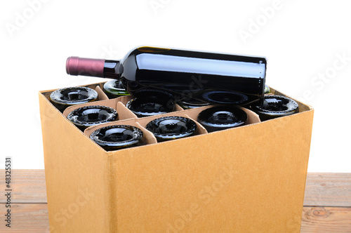 Photo: Case of Wine with Bottle on Top Case of Wine with Bottle on Top